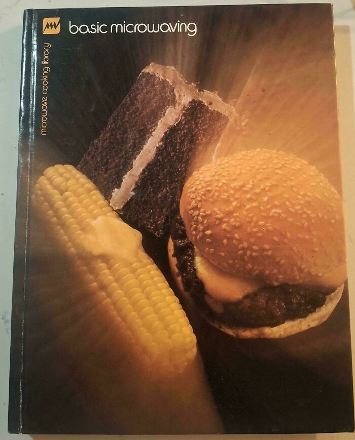 Terrible book cover featuring a burger, corn, and cake for a microwave cooking book.