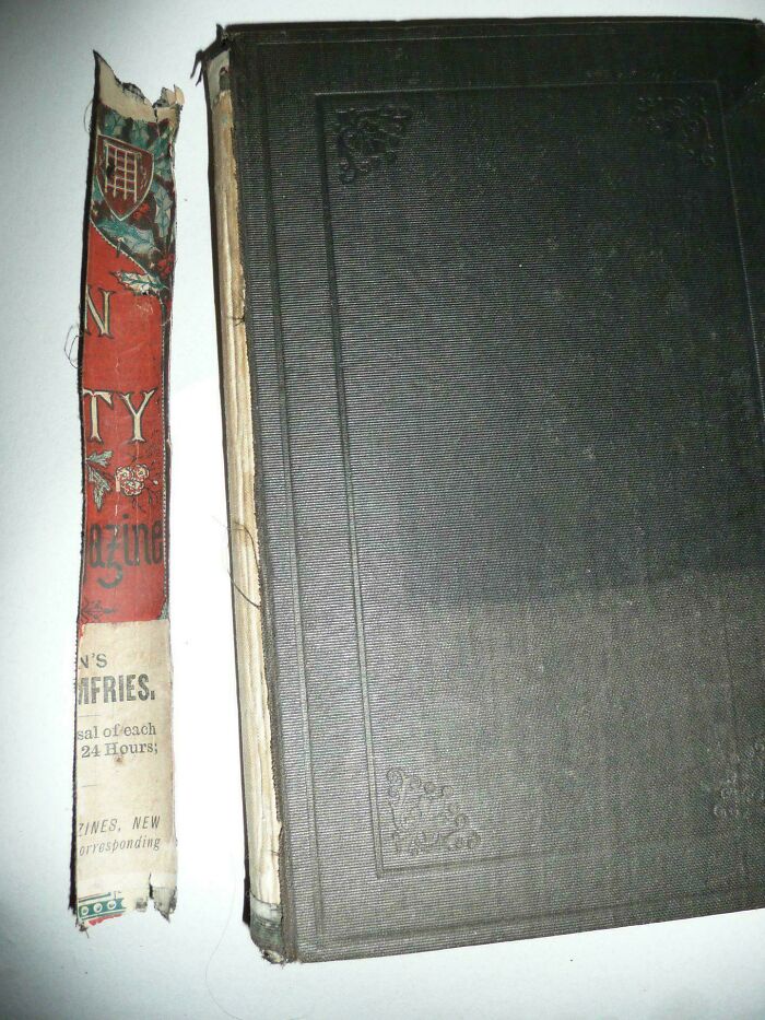 Old, worn book with detached spine showcasing vintage design, exemplifying cool-old-things.