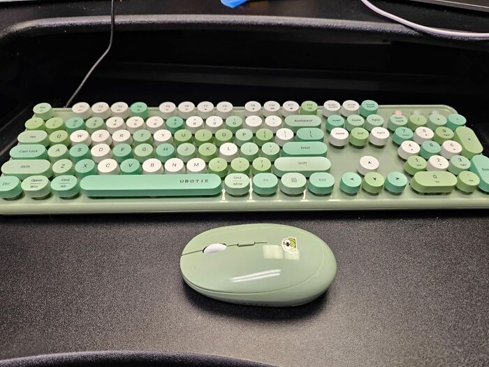 Green keyboard and mouse set, essential tech for work from home setup.