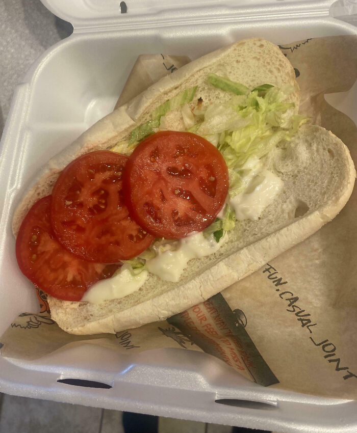 Sparse sandwich with minimal fillings, showcasing infuriating food scams.