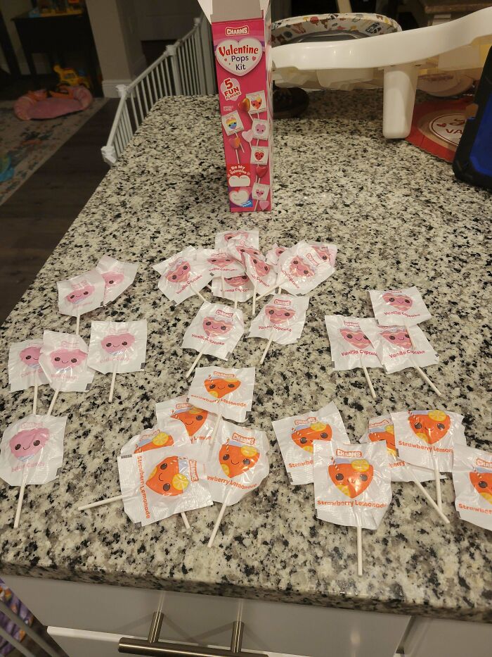 Valentine Pops Kit with mismatched lollipop wrappers on a granite countertop, showcasing Valentines-Day-Fails.