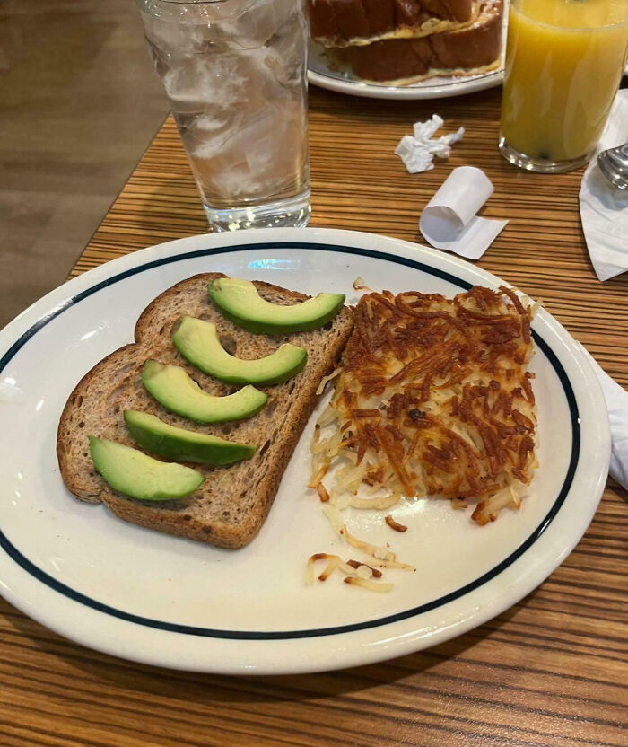 Avocado toast with hash browns, highlighting food scams with minimal toppings.