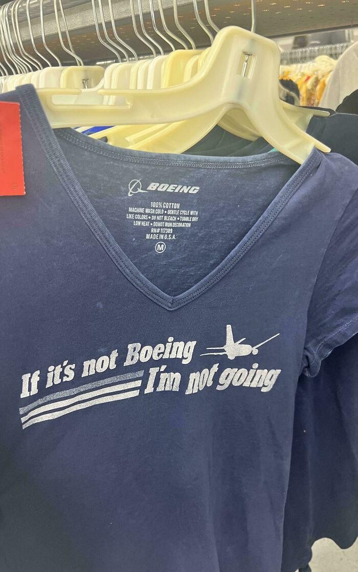 T-shirt with "If it's not Boeing I'm not going" slogan on clothing rack, future predictions aged bad theme.