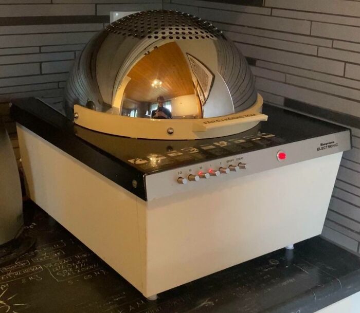 Retro electronic cooking device with a shiny metal dome, a perfect example of cool-old-things in vintage kitchens.
