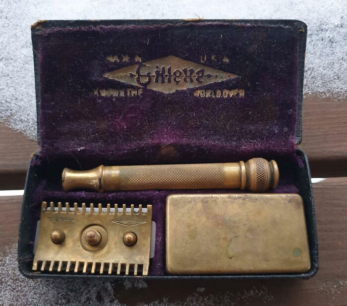 Vintage Gillette safety razor in a worn case, showcasing cool old things.