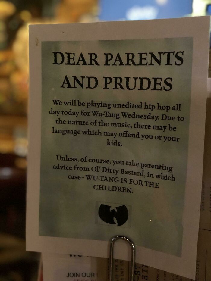 Sign at a Florida location for Wu-Tang Wednesday about unedited hip hop music, addressing parents and featuring the Wu-Tang Clan logo.