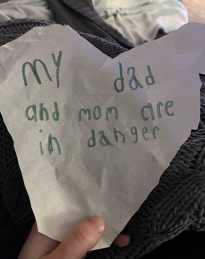 Child's handwritten note on torn paper, related to dumb-clueless-kids theme.