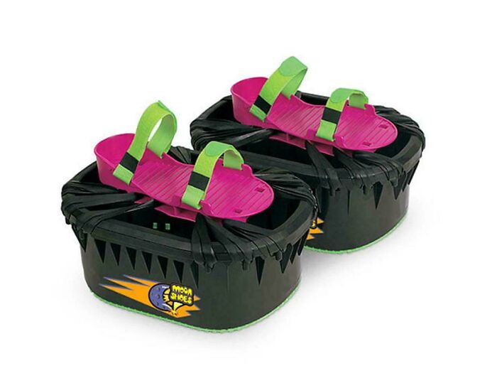 Bright '90s Moon Shoes with pink platforms and green straps on a white background.