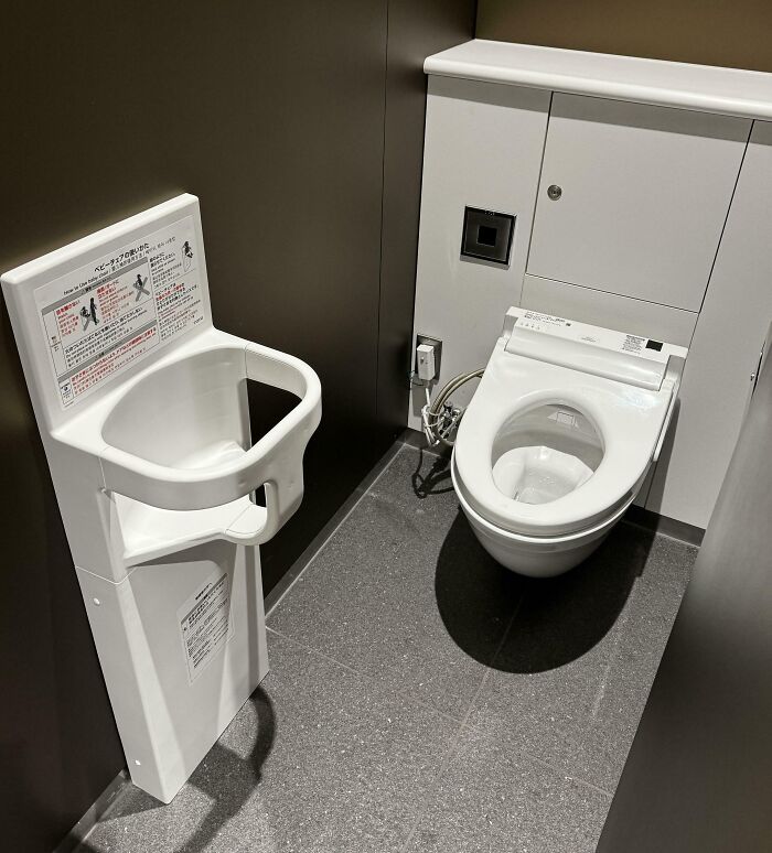Modern toilet in Japan with an attached baby seat, showcasing unique Japanese restroom design.