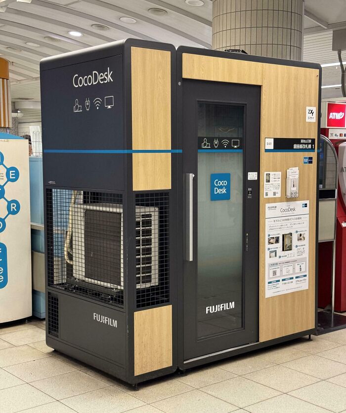 CocoDesk workstation in Japan, showcasing innovative design and functionality with wood panels and a see-through feature.