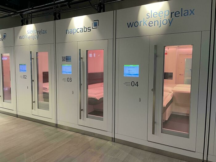 Napcabs at an airport, featuring small rooms with beds for travelers to sleep and relax.