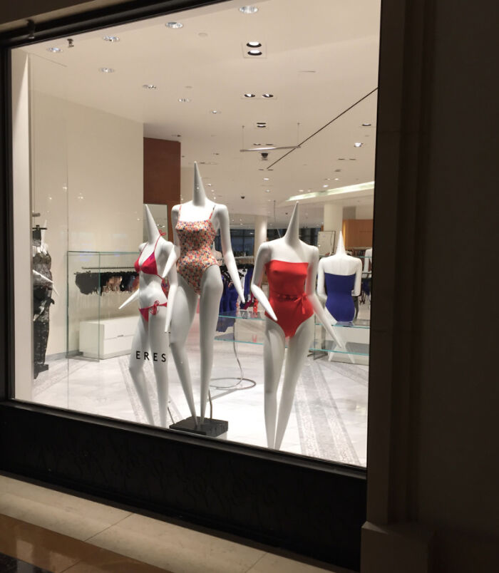 Mannequins in swimsuits on display in a Tokyo store, showcasing interesting fashion in Japan.