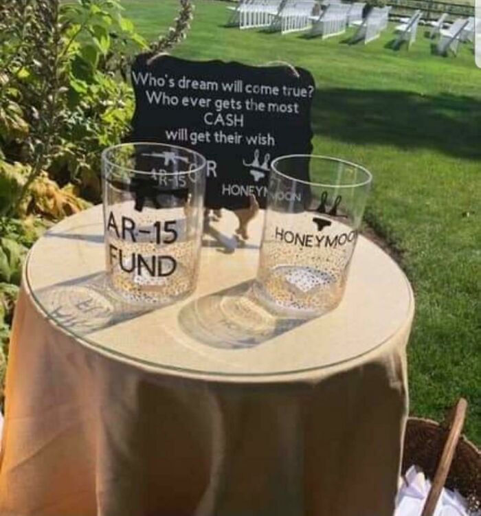 Two jars labeled "AR-15 Fund" and "Honeymoon" on a table display a humorous budget-wedding-fails theme.