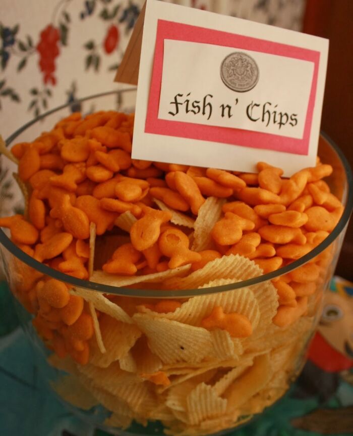 Bowl of goldfish crackers and potato chips labeled "fish n' chips," illustrating a hilarious misunderstanding.