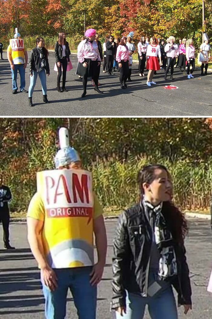 Group in costumes, including a man dressed as a spray can, in a humorous outdoor scene.