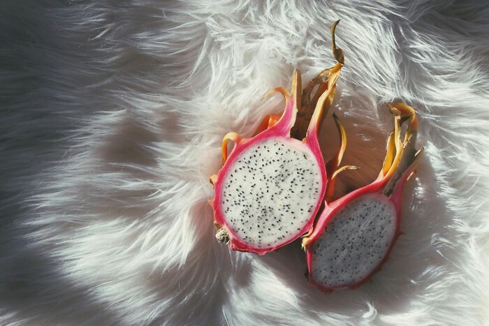 Dragon fruit on a fluffy white surface showcasing its vibrant and health-boosting properties.