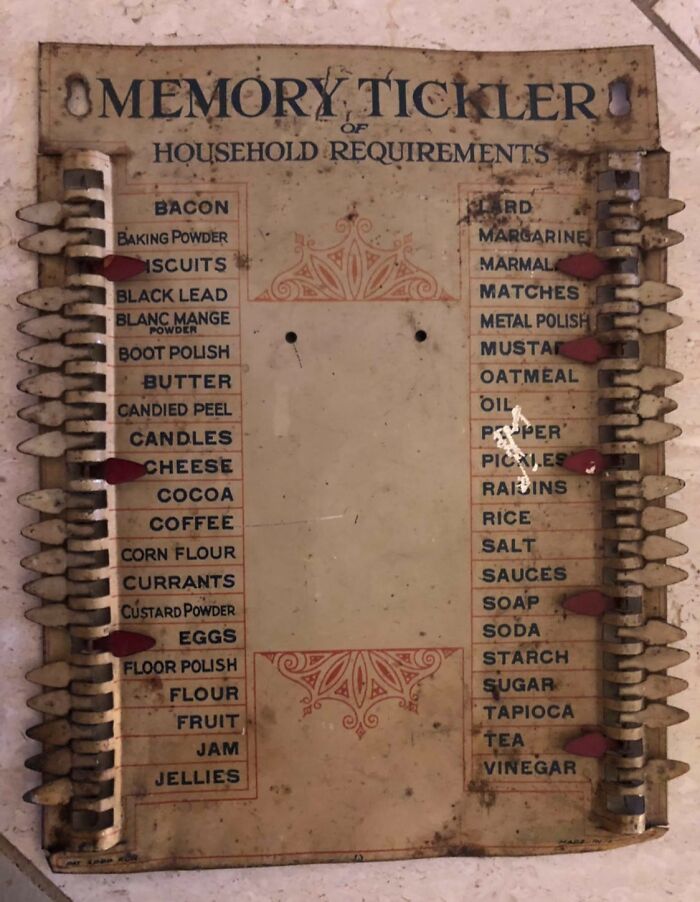 Cool-old-things: Vintage household requirements memory tickler with labeled sliding tabs for groceries.