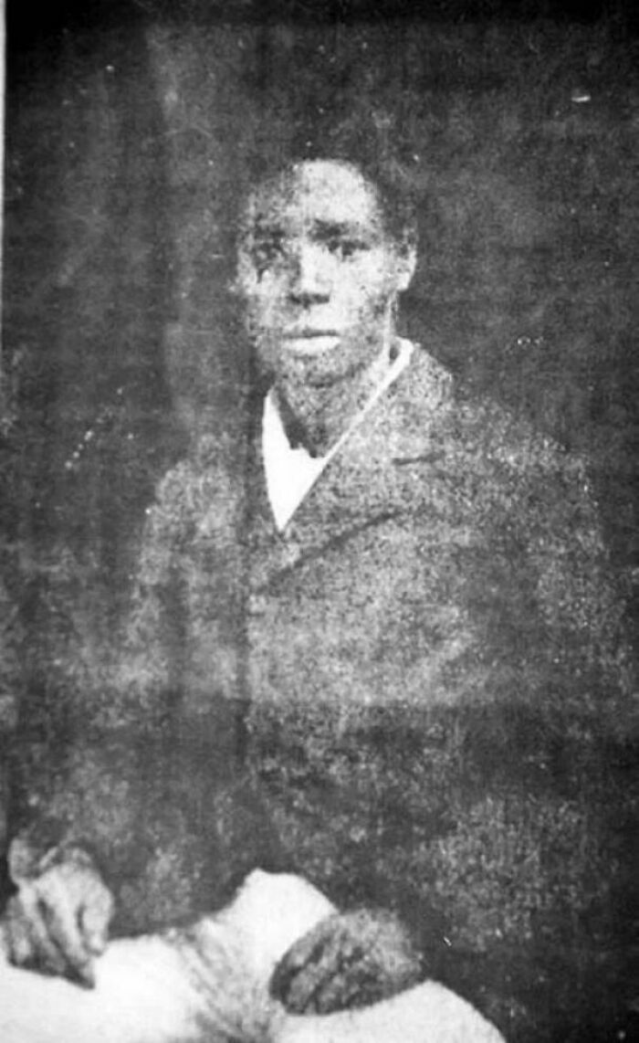 Old black and white photo of a person wearing a suit, relating to interesting facts.