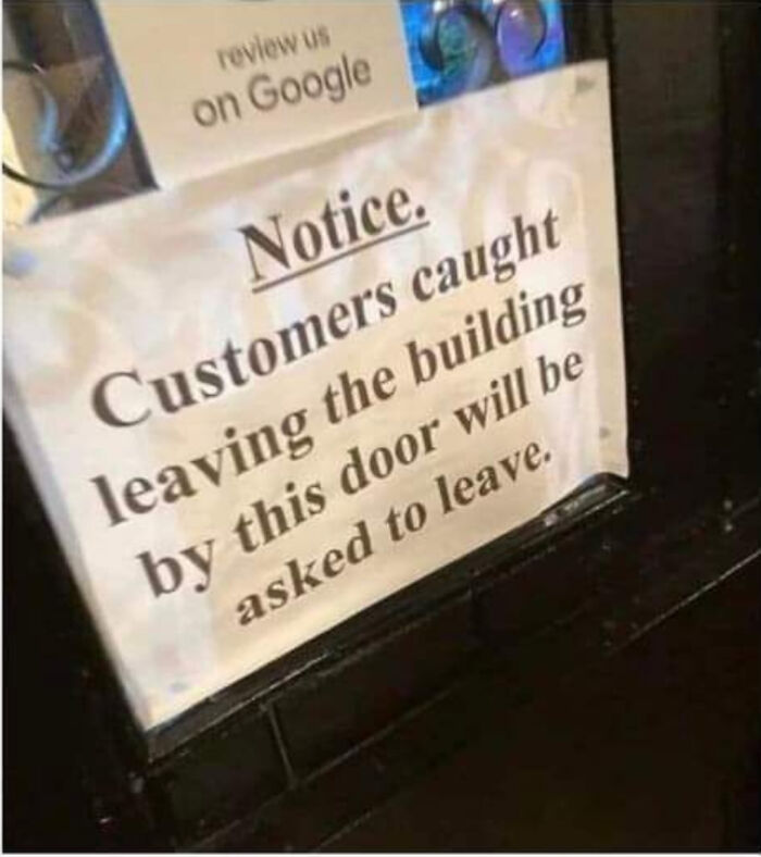 Funny sign with notice: "Customers caught leaving by this door will be asked to leave."