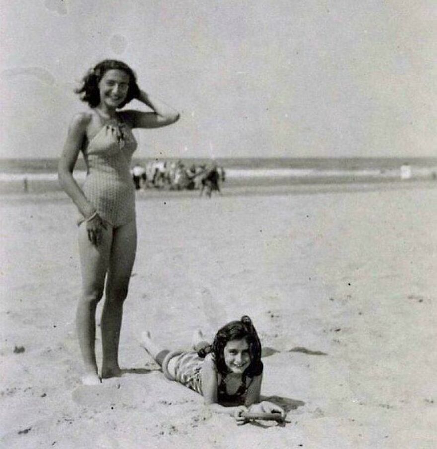 Two girls in vintage swimwear enjoying a day at the beach, representing unseen historical moments.