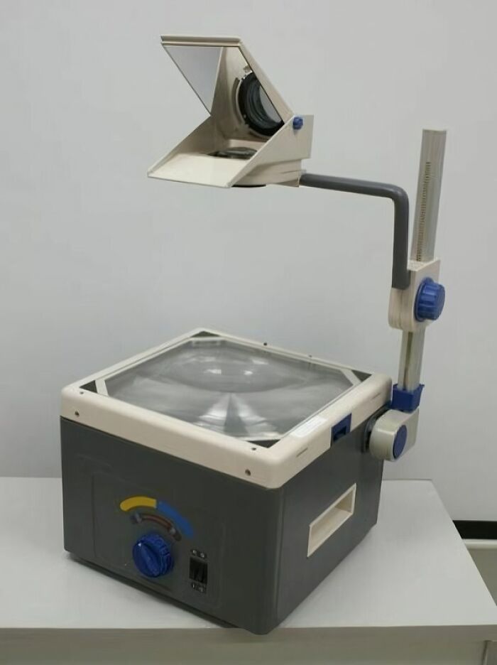 Overhead projector on a table, showcasing old-school items memories.