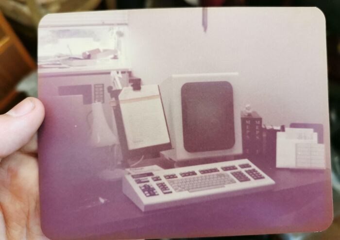A vintage computer setup on a desk, showcasing cool-old-things from a past era.
