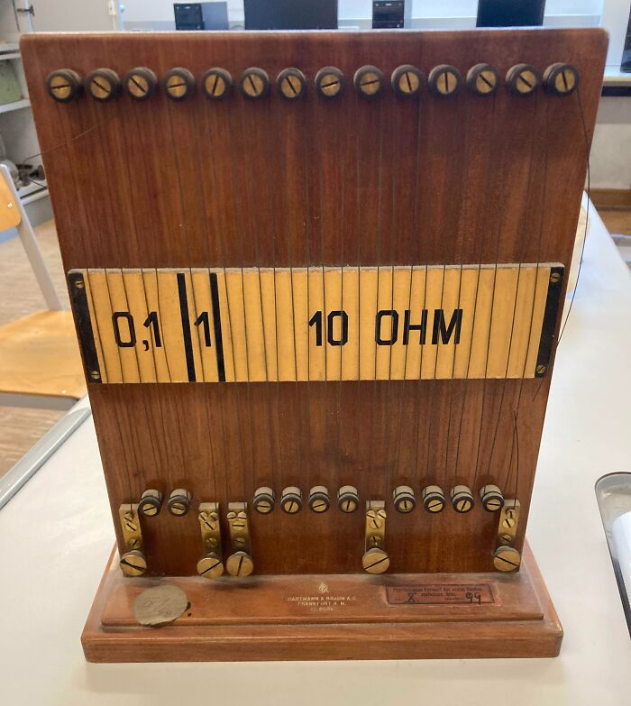 Old-school electrical resistance box on a table, evoking memories of vintage technology and engineering tools.