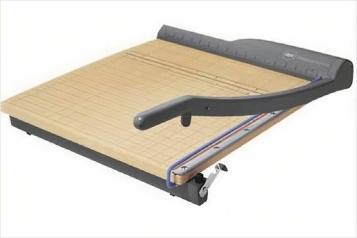 Paper cutter from old-school memories, featuring a wooden base and a black lever arm.