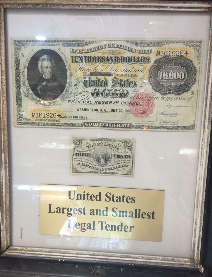 Framed display of cool old things: U.S. largest and smallest legal tender currency notes.