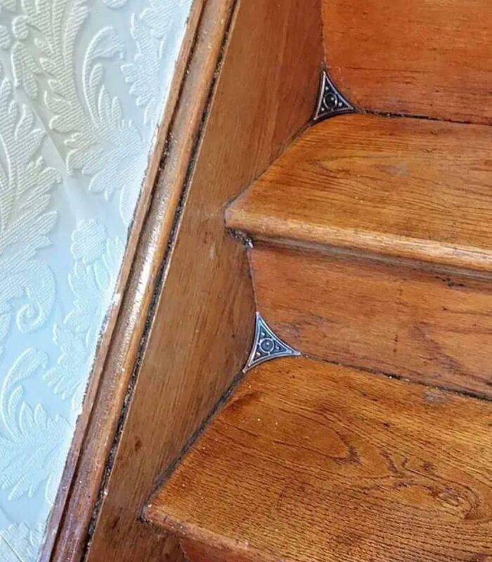 Vintage staircase detail with corner dust guards, showcasing Cool-Old-Things design and craftsmanship.