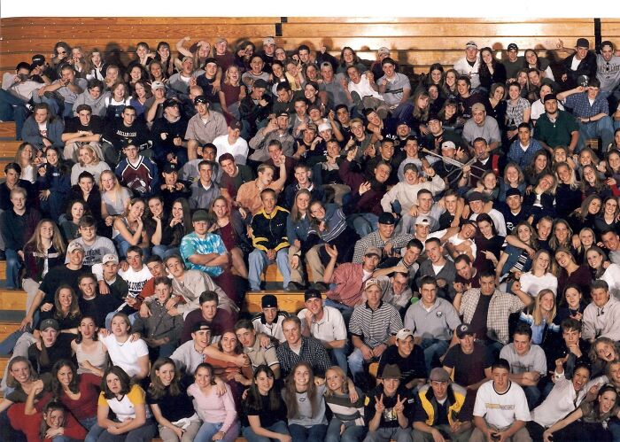 Large group photo in a gymnasium setting, related to photographs with terrifying backstories.