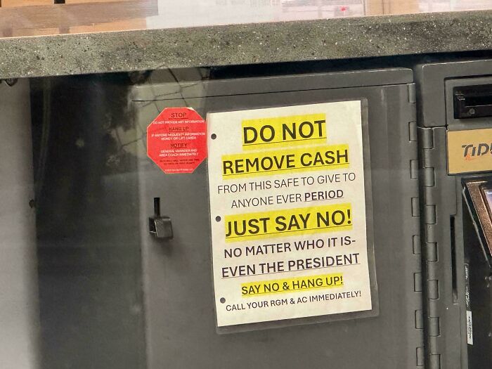 Sign on a safe with humorous warning about not removing cash, even for the president. Funny signs and billboards.