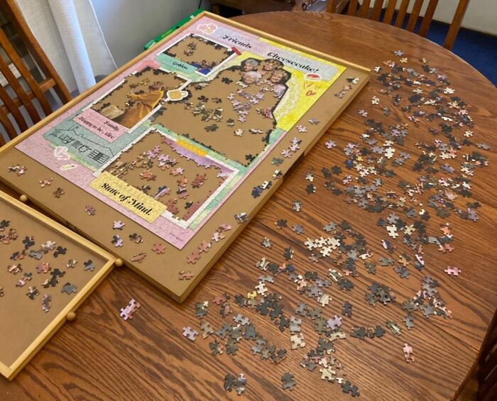 Puzzle pieces scattered on a table, perfect activity for long term couples on V-Day.