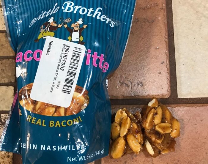 Bag of Little Brothers bacon brittle snack with pieces of the crunchy treat on a tiled surface highlighting unusual snacks.