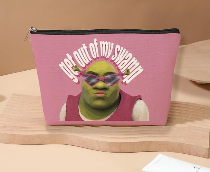 Pink bag with a graphic of an ogre in sunglasses and "get out of my swamp" text, illustrating a quirky impulse buy.
