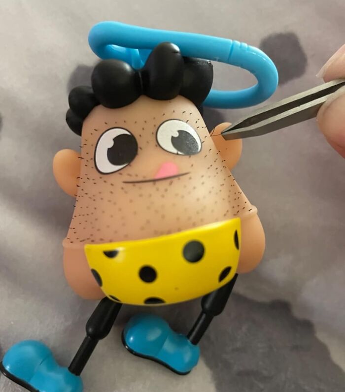 Toy figurine with black hair and a yellow polka-dot outfit, an example of impulse buys that turned out well.