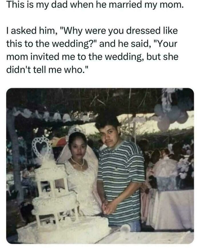 Bride and groom standing by a wedding cake, groom in casual attire. Strange and funny moment.