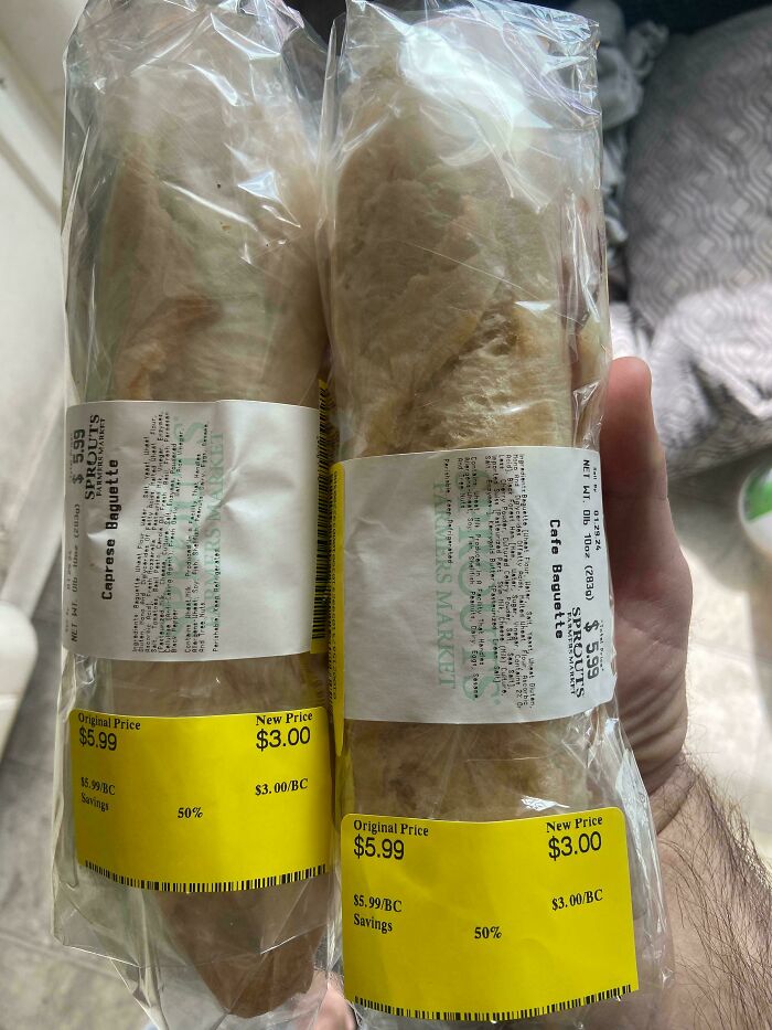 Two discounted baguettes with yellow price tags, demonstrating grocery-shopping-hacks for savvy savings.