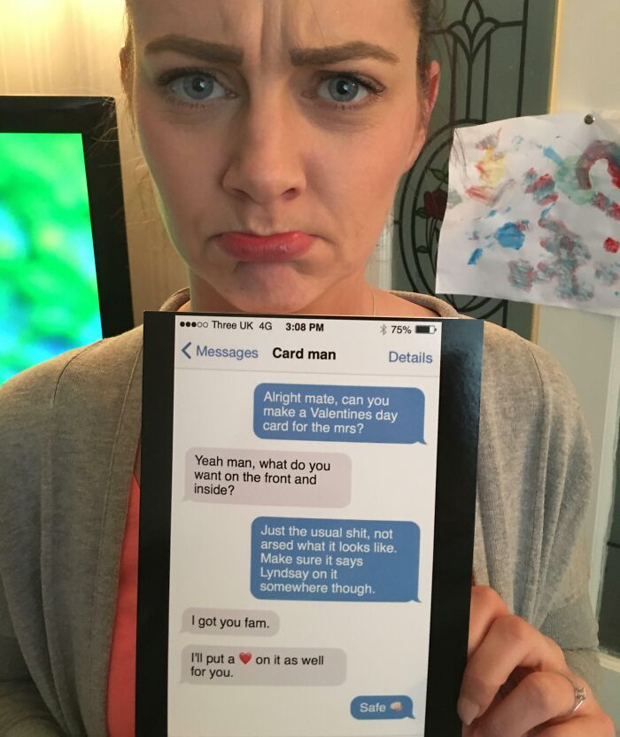 A woman with a pouty face holds a humorous Valentine's gift text exchange card.