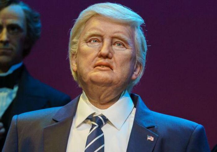 "Wax figure of a man in a suit, symbolizing themes related to controversial conspiracy theories."