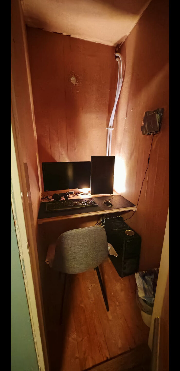 Small cozy workspace with computer setup and chair, illustrating dads doing their best parenting moments in humble conditions.