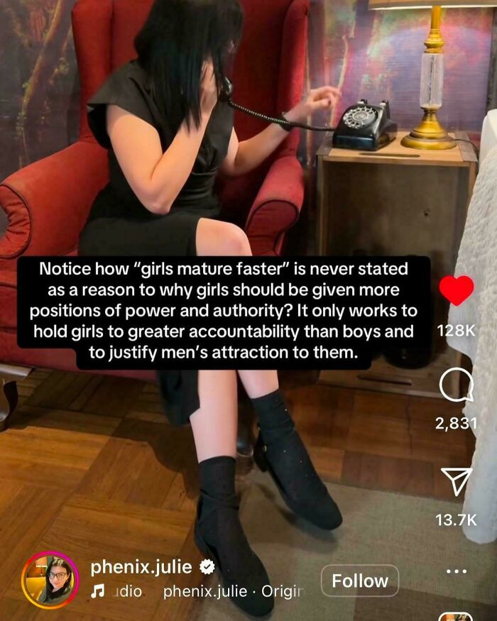 Woman in a red chair on phone with text challenging stereotypes about girls maturing faster than boys.