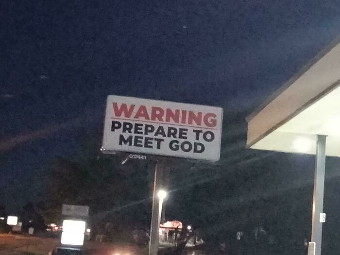 Billboard at night with a warning message: "Prepare to Meet God." Funny-Signs-Billboards theme.
