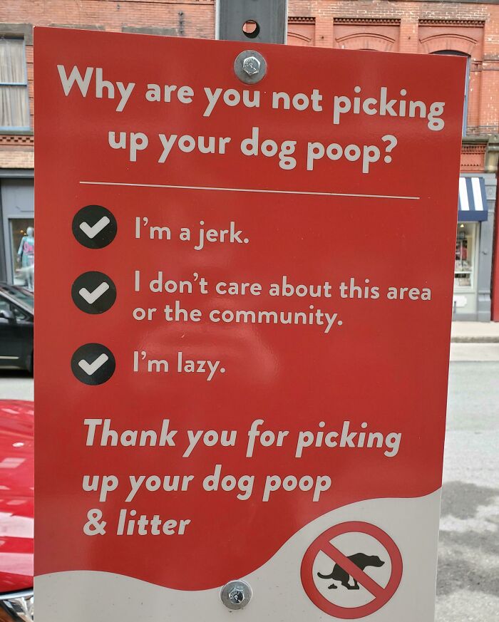 Funny signs on a red billboard, humorously thanking for cleanup.