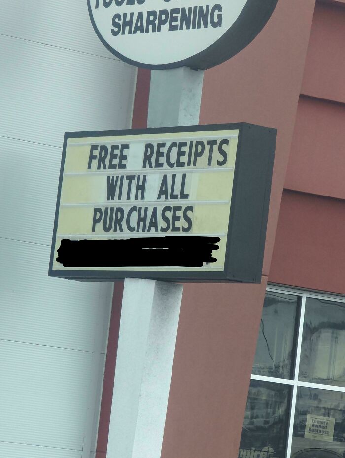 Funny sign offering "Free Receipts with All Purchases" outside a sharpening store.