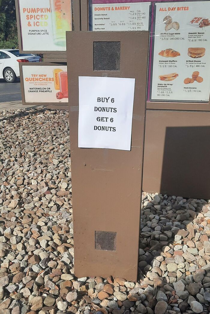 Funny sign at a drive-thru: "Buy 6 donuts, get 6 donuts" promotion on a billboard.