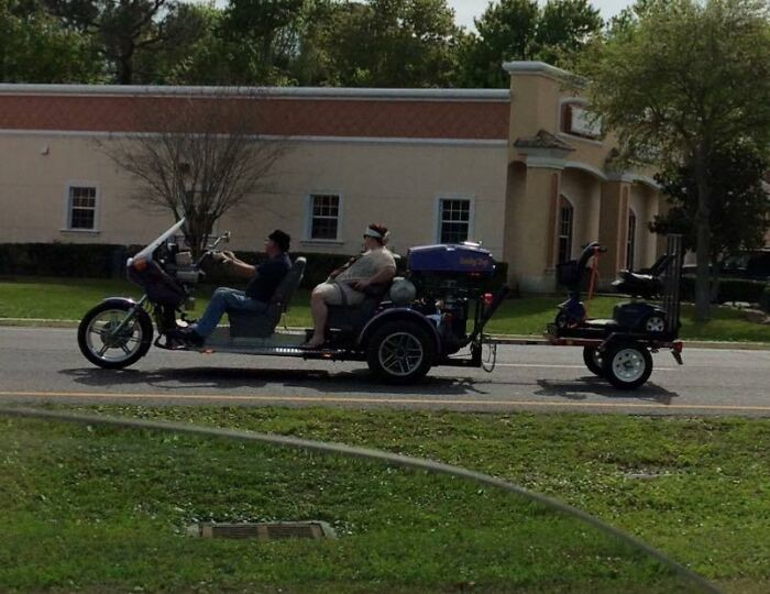 Two people on a trike with a trailer in Florida, showcasing unique transport, embodying Florida-Wild-Moments.