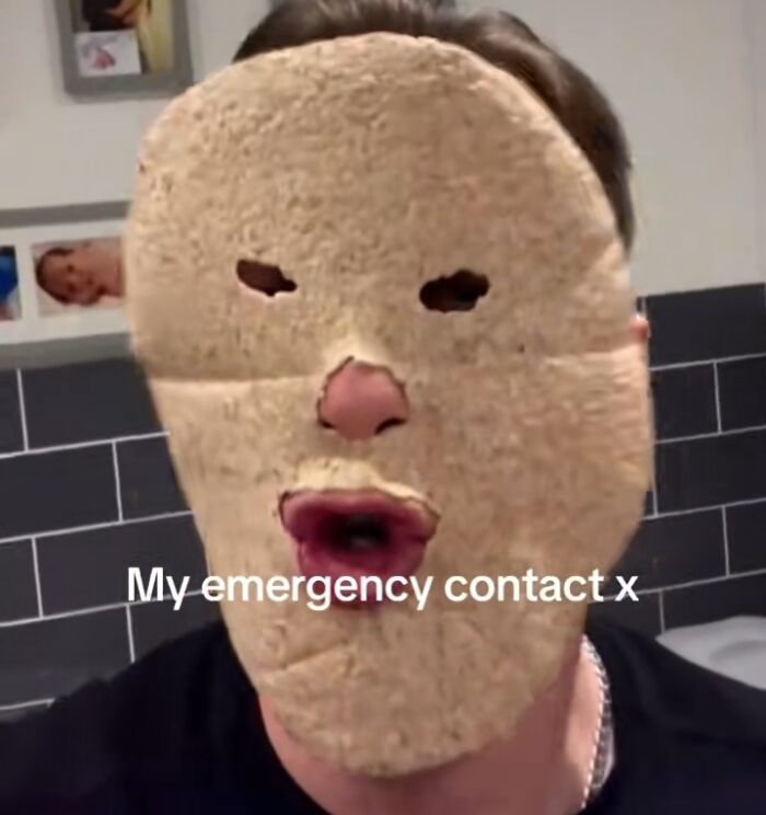Man wearing bread mask with text "My emergency contact x," humorously portraying an emergency crisis.