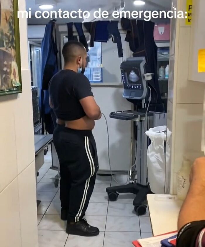 Man in a casual setting with emergency equipment, highlighting a crisis theme.