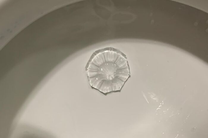 Clear soap shaped like a flower on a white surface, demonstrating affordable items under 5 dollars.